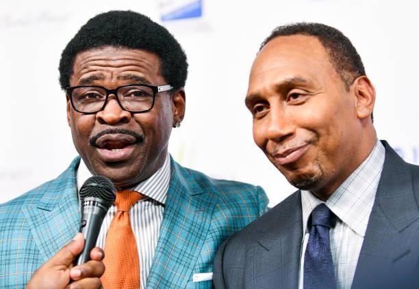 Michael Irvin and Stephen A. Smith banter at the Harold and Carole Pump Foundation Gala at The Beverly Hilton on August 20, 2021 in Beverly Hills,...
