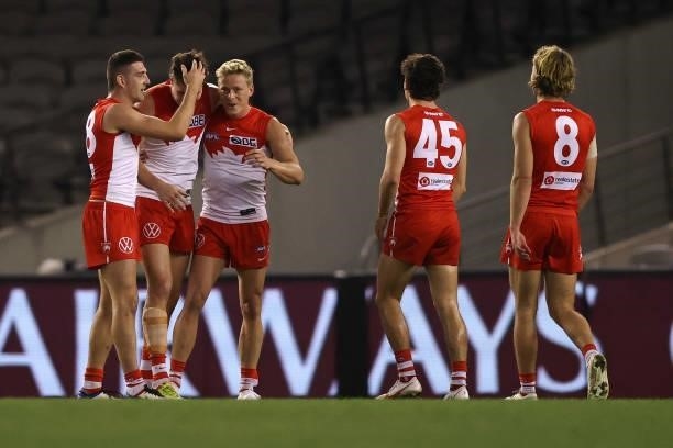 Hayden McLean of the Swans celebrates kicking a goal with team mates during the round 23 AFL match between Sydney Swans and Gold Coast Suns at Marvel...