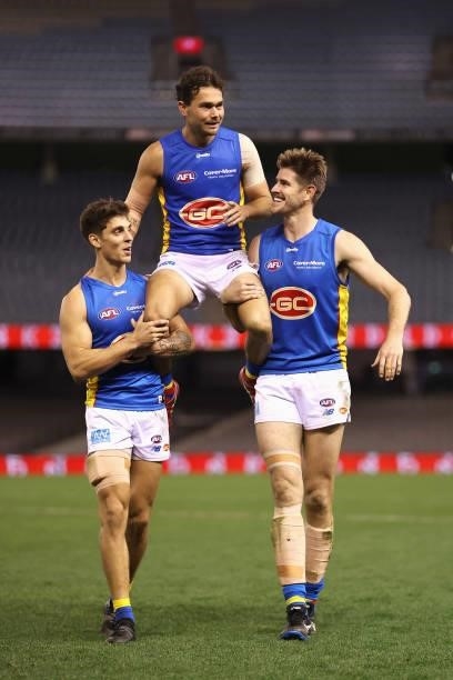 Jarrod Harbrow of the Suns is chaired off the field following playing his last AFL match during the round 23 AFL match between Sydney Swans and Gold...