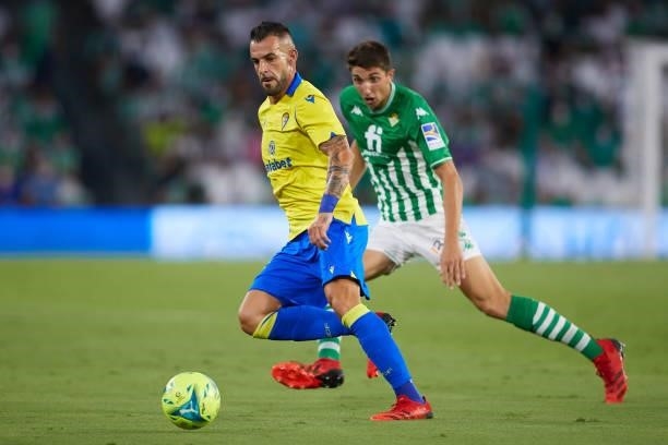 Edgar of Real Betis competes for the ball with Alvaro Negredo of Cadiz CF during the La Liga Santader match between Real Betis and Cadiz CF on Friday...