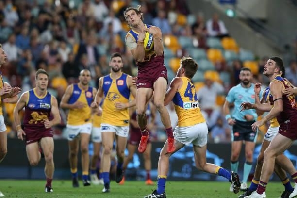 Jarrod Berry of the Lions marks the ball during the round 23 AFL match between Brisbane Lions and West Coast Eagles at The Gabba on August 21, 2021...