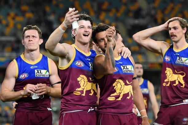 Jaxon Prior and Callum Ah Chee of the Lions celebrate victory during the round 23 AFL match between the Brisbane Lions and the West Coast Eagles at...
