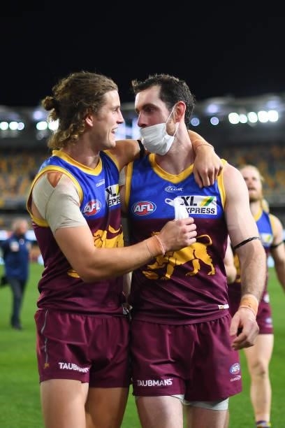 Jarrod Berry and Darcy Gardiner of the Lions celebrate victory during the round 23 AFL match between the Brisbane Lions and the West Coast Eagles at...
