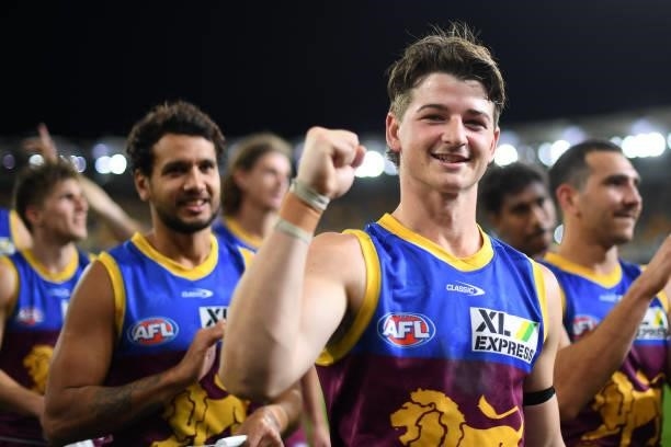 Jaxon Prior of the Lions celebrates his team's victory during the round 23 AFL match between the Brisbane Lions and the West Coast Eagles at The...