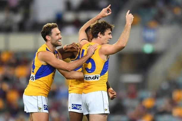 Jamie Cripps of the Eagles celebrates with team mates after kicking a goal during the round 23 AFL match between the Brisbane Lions and the West...