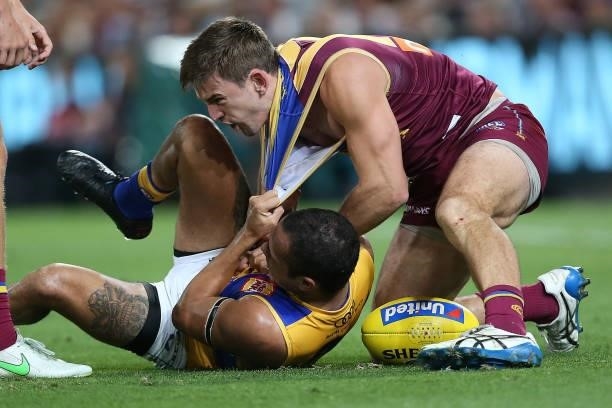 Jamaine Jones of the Eagles clashes with Jarryd Lyons of the Lions during the round 23 AFL match between Brisbane Lions and West Coast Eagles at The...