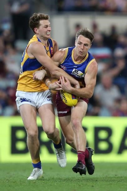 Alex Witherden of the Eagles clashes with Lincoln McCarthy of the Lions during the round 23 AFL match between Brisbane Lions and West Coast Eagles at...