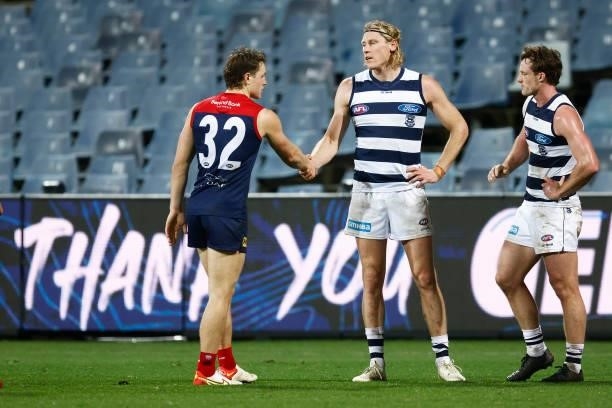 Tom Sparrow of the Demons shakes hands with Mark Blicavs of the Cats after the round 23 AFL match between Geelong Cats and Melbourne Demons at GMHBA...