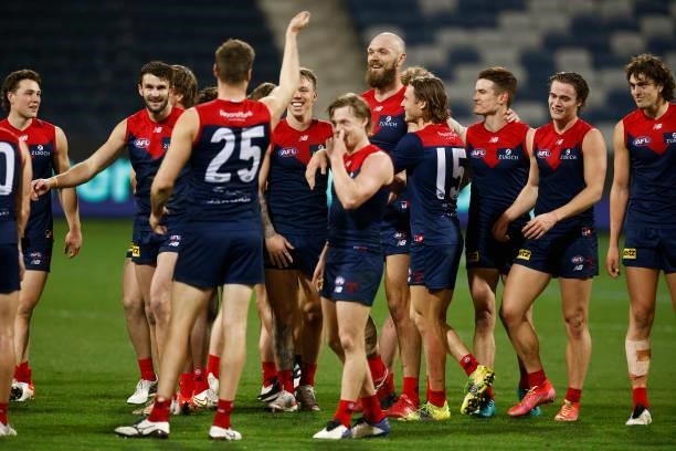 The Demons leave the field celebrating after winning the round 23 AFL match between Geelong Cats and Melbourne Demons at GMHBA Stadium on August 21,...