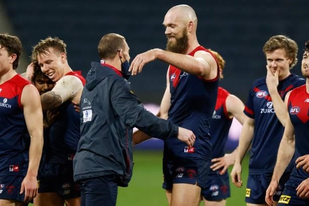Demons head coach Simon Goodwin hugs Max Gawn of the Demons after winning the round 23 AFL match between Geelong Cats and Melbourne Demons at GMHBA...