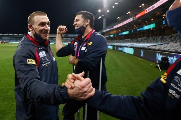 Demons head coach Simon Goodwin celebrates after the round 23 AFL match between Geelong Cats and Melbourne Demons at GMHBA Stadium on August 21, 2021...