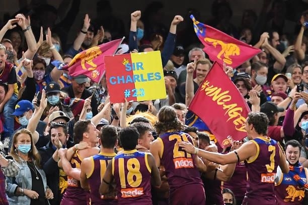 Brisbane Lions celebrate victory during the round 23 AFL match between the Brisbane Lions and the West Coast Eagles at The Gabba on August 21, 2021...