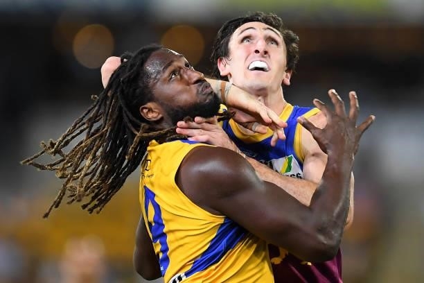 Nic Naitanui of the Eagles and Oscar McInerney of the Lions compete for the ball during the round 23 AFL match between the Brisbane Lions and the...