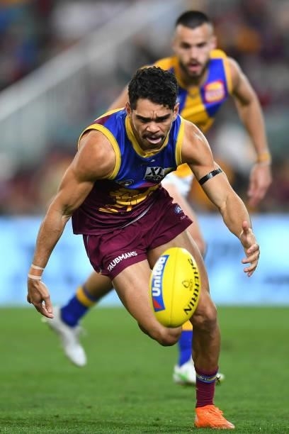 Charlie Cameron of the Lions chases after a ball during the round 23 AFL match between the Brisbane Lions and the West Coast Eagles at The Gabba on...