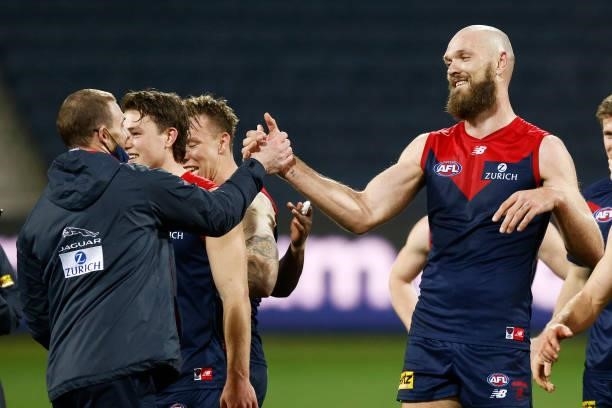 Demons head coach Simon Goodwin shakes hands with Max Gawn of the Demons after winning the round 23 AFL match between Geelong Cats and Melbourne...