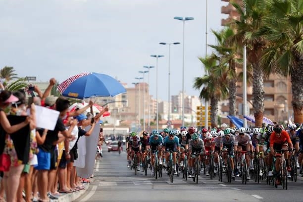 General view of the peloton compete while fans cheer during the 76th Tour of Spain 2021, Stage 8 a 173,7 km stage from Santa Pola to La Manga del Mar...