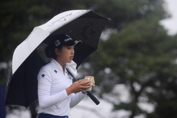 Yealimi Noh of the United States shelters under her umbrella during Day Three of the AIG Women's Open at Carnoustie Golf Links on August 21, 2021 in...