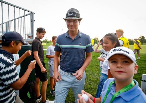 Tapio Pulkkanen of Finland with young fans on the 18th hole during Day Three of The D+D Real Czech Masters at Albatross Golf Resort on August 21,...