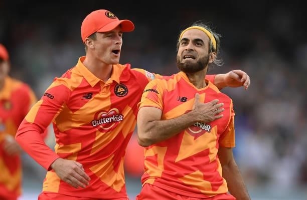 Imran Tahir of Birmingham Phoenix Men celebrates after taking the wicket of Paul Stirling of Southern Brave Men with team mate Tom Abell during The...