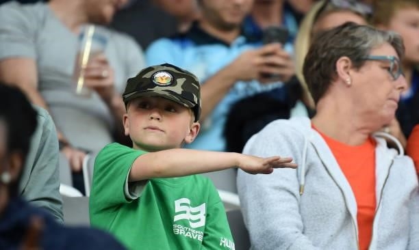 Fans react in the crowd during The Hundred Final match between Birmingham Phoenix Men and Southern Brave Men at Lord's Cricket Ground on August 21,...