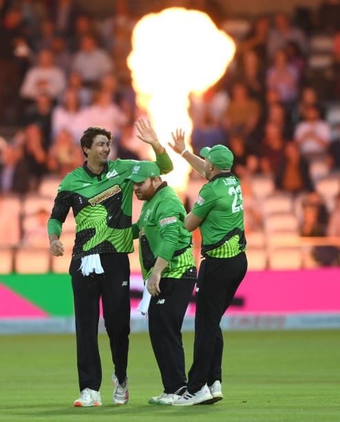 Brave fielder Tim David is congratulated after his catch to dismiss David Bedingham during The Hundred Final match between Birmingham Phoenix Men and...