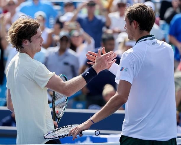 Andrey Rublev of Russia and Daniil Medvedev of Russia shake hands after Rublev won their match 2-6, 6-3, 6-3 during day 7 of the Western & Southern...