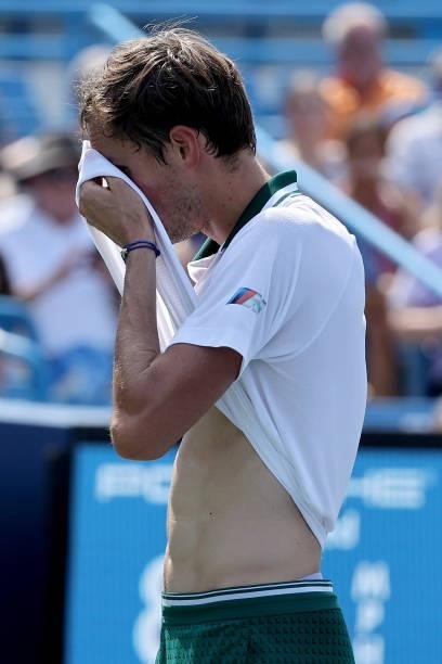 Daniil Medvedev of Russia wipes his face with his shirt during his match against Andrey Rublev of Russia during day 7 of the Western & Southern Open...