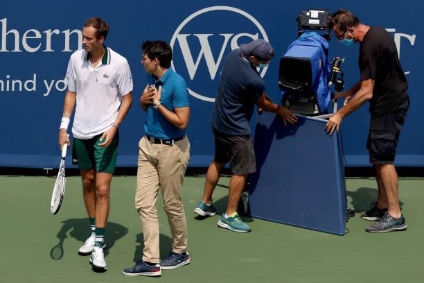 Daniil Medvedev of Russia speaks to chair umpire Nacho Forcadell after colliding with a television camera in his match against Andrey Rublev of...