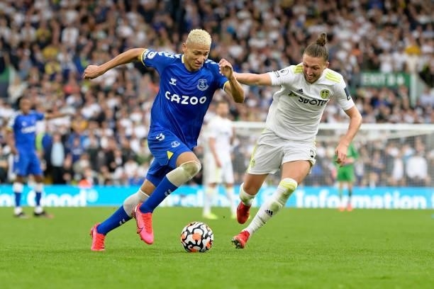 Richarlison of Everton and Luke Ayling challenge for the ball during the Premier League match between Leeds United and Everton at Elland Road on...