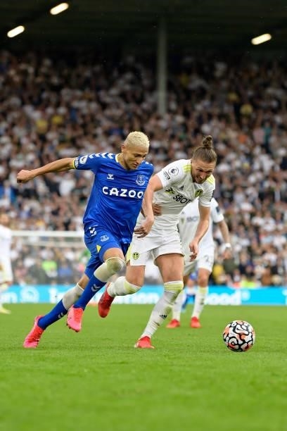 Richarlison of Everton and Luke Ayling challenge for the ball during the Premier League match between Leeds United and Everton at Elland Road on...