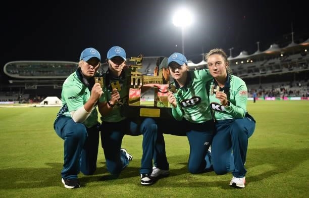 Dane van Niekerk, Grace Gibbs, Mady Villiers and Alice Capsey of Oval Invincibles Women celebrate following The Hundred Final match between Southern...