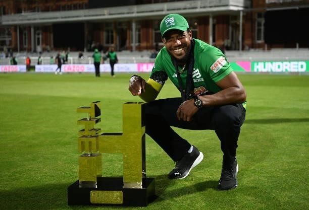 Chris Jordan of Southern Brave Men poses with The Men's Hundred Trophy following The Hundred Final match between Birmingham Phoenix Men and Southern...