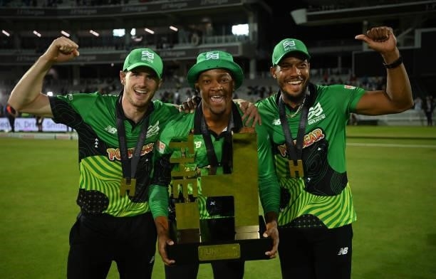 George Garton, Delray Rawlins and Chris Jordan of Southern Brave Men poses with The Men's Hundred Trophy following The Hundred Final match between...