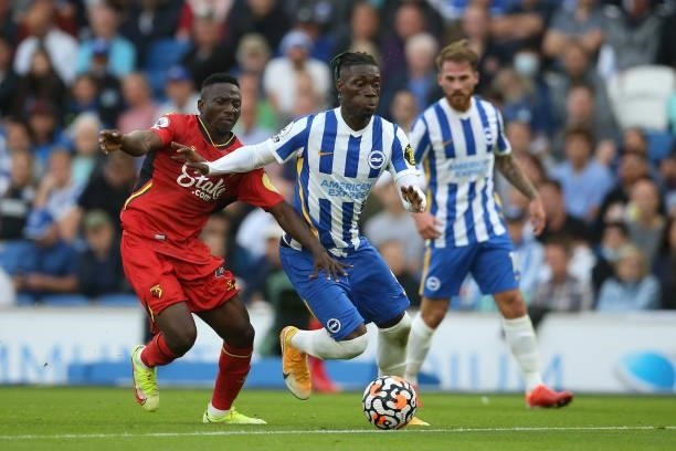 Yves Bissouma of Brighton & Hove Albion battles for possession with Peter Etebo of Watford FC during the Premier League match between Brighton & Hove...