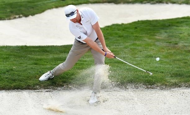 Trey Mullinax hits hits out of a bunker on the fifth hole during the round three of the Albertsons Boise Open at Hillcrest Country Club on August 21,...