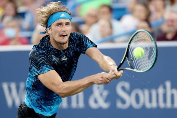 Alexander Zverev of Germany returns a shot to Stefanos Tsitsipas of Greece during the semifinals of the Western & Southern Open at Lindner Family...