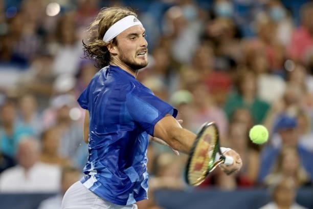 Stefanos Tsitsipas of Greece returns a shot to Alexander Zverev of Germany during the semifinals of the Western & Southern Open at Lindner Family...