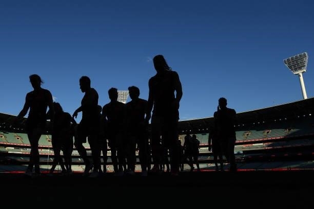 The Bombers walk from the field during the round 23 AFL match between Essendon Bombers and Collingwood Magpies Giants at Melbourne Cricket Ground on...