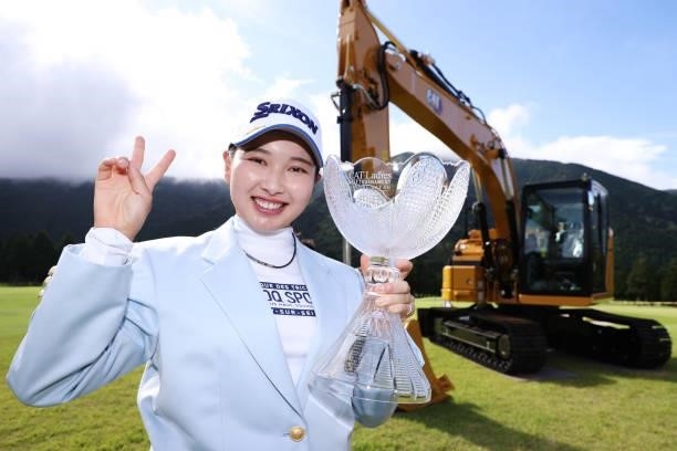 Sakura Koiwai of Japan poses after winning the tournament following the final round of the CAT Ladies at Daihakone Country Club on August 22, 2021 in...