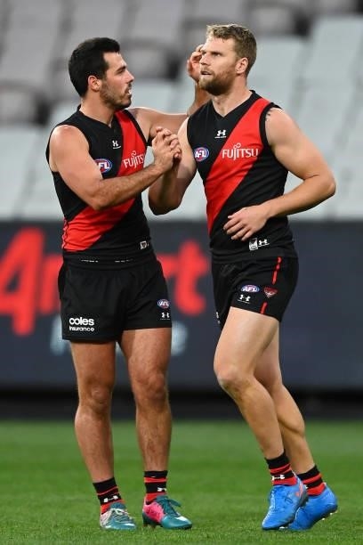 Jake Stringer of the Bombers is congratulated by teammate Alec Waterman during the round 23 AFL match between Essendon Bombers and Collingwood...