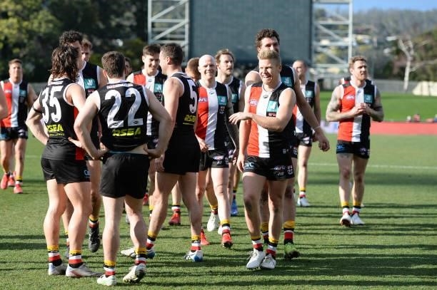 St Kilda players celebrate the win during the round 23 AFL match between St Kilda Saints and Fremantle Dockers at Blundstone Arena on August 22, 2021...