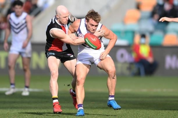 Mitch Crowden of the Dockers is tackled by Zak Jones of the Saints during the round 23 AFL match between St Kilda Saints and Fremantle Dockers at...