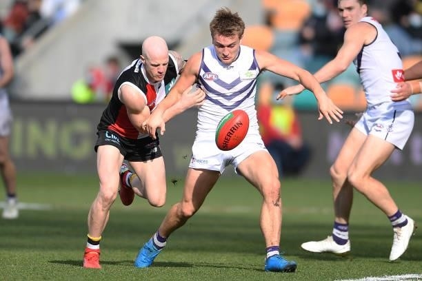 Mitch Crowden of the Dockers is tackled by Zak Jones of the Saints during the round 23 AFL match between St Kilda Saints and Fremantle Dockers at...