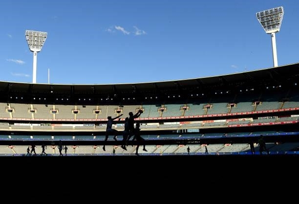 Players compete for a mark during the round 23 AFL match between Essendon Bombers and Collingwood Magpies Giants at Melbourne Cricket Ground on...