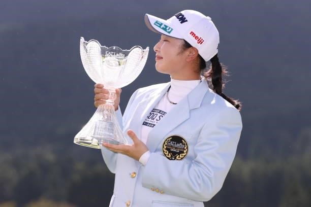 Sakura Koiwai of Japan poses with a trophy after winning the tournament following the final round of the CAT Ladies at Daihakone Country Club on...