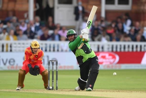 Brave batsman Paul Stirling hits out watched by Phoenix keeper Chris Benjamin during The Hundred Final match between Birmingham Phoenix Men and...