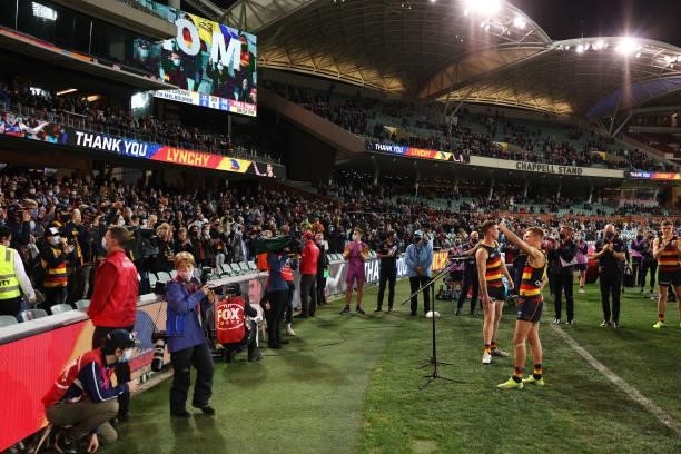 David Mackay of the Crows and Tom Lynch of the Crows speak to fans during the round 23 AFL match between Adelaide Crows and North Melbourne Kangaroos...