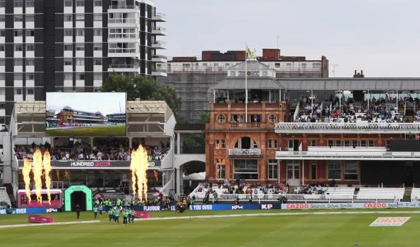 The Oval Invincibles take to the field for the second innings through flames during The Hundred Final match between Southern Brave Women and Oval...