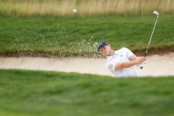 Oliver Fisher of England plays a bunker shot on the ninth hole during Day Four of The D+D Real Czech Masters at Albatross Golf Resort on August 22,...