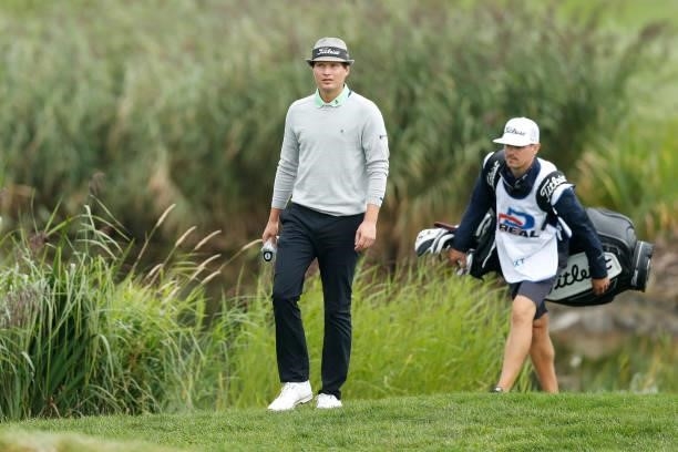 Tapio Pulkkanen of Finland makes his way along the ninth hole with his caddie during Day Four of The D+D Real Czech Masters at Albatross Golf Resort...